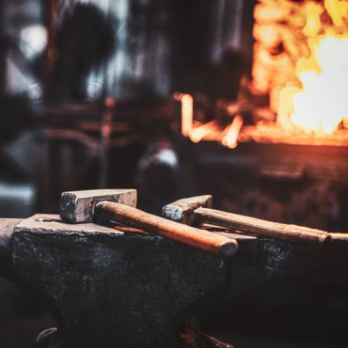 dark-stithy-workshop-with-hammer-anvil-firs-plan-fire-stove-background (1)