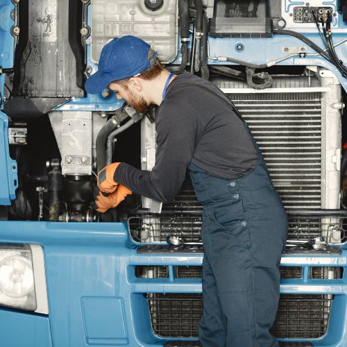 man-with-tools-truck-worker-uniform-faulty-truck (1)