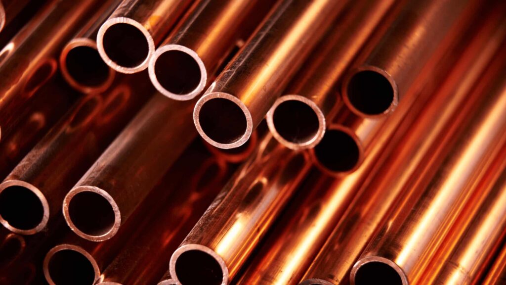 Polished copper pipes arranged in a bundle