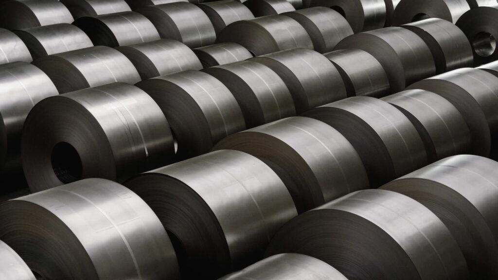 Rows of rolled steel sheets in a factory