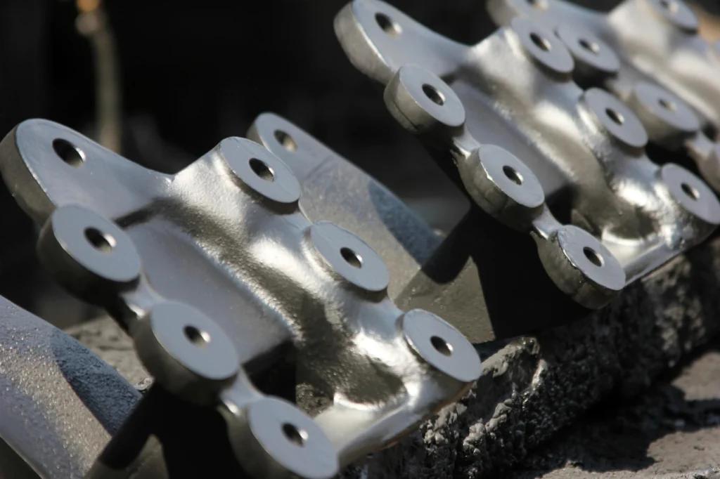 Close-up of finished metal casting parts with a polished surface, ready for assembly or use.