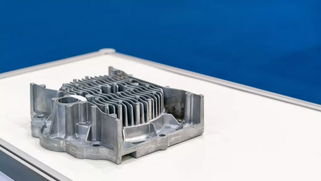 Aluminum die-cast heat sink component with multiple fins for effective heat dissipation.