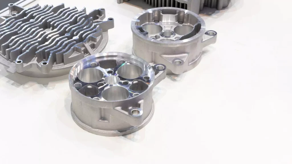 Close-up of machined aluminum die-cast components with a smooth and polished surface finish.