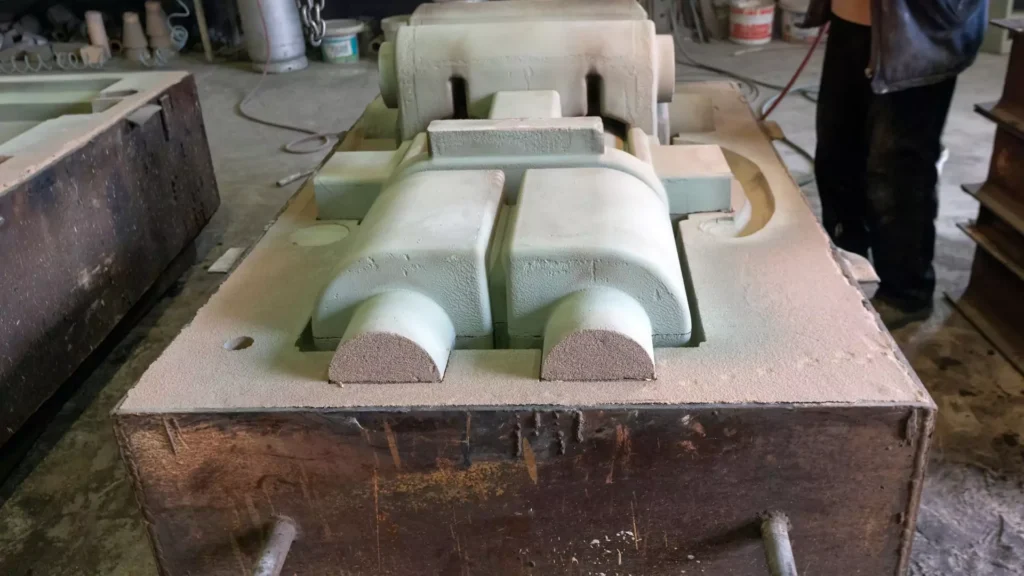 A sand casting pattern prepared for creating molds in metal casting.